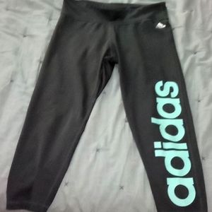 Dark gray adidas Capri leggings, teal logo on side